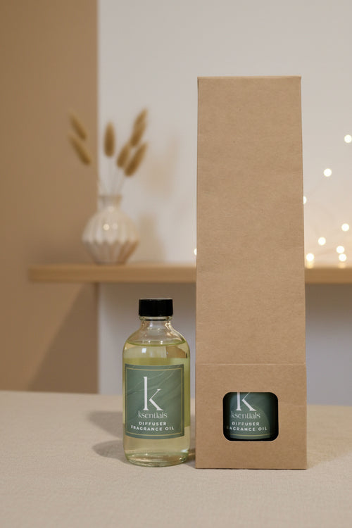 Ksentials diffused fragrance oil bottle and box on a neutral background